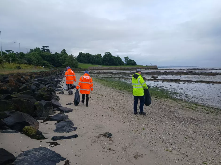 Veolia volunteers cleaning the beach